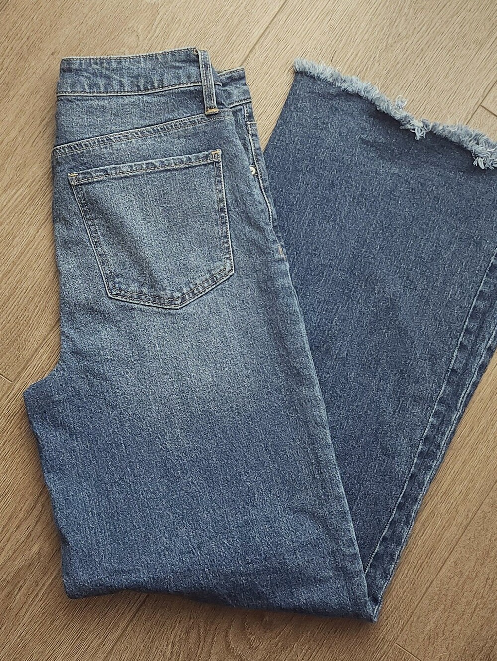 Classic High-Rise Blue Denim Jeans with Raw Hem